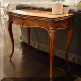 F23. Antique burlwood game table with tooled leather playing surface c. 19th century. 29”h x 33”w 16”d 